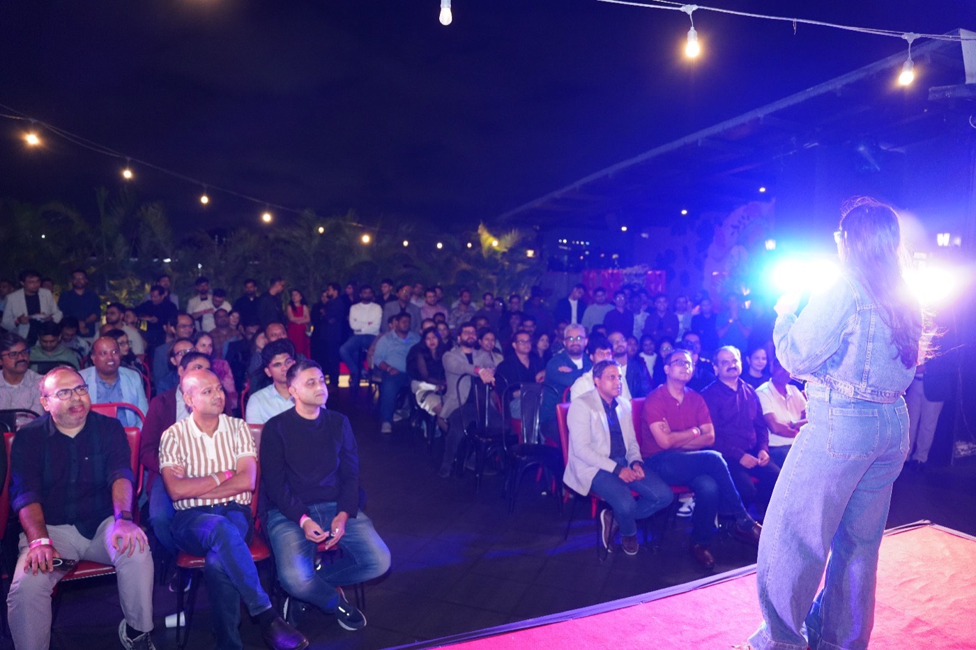 A full corporate audience laughing
